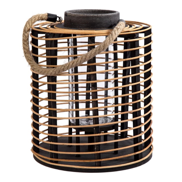 Truu Design, Cylindrical Rattan and Wooden Lantern with vertical black wooden slats and horizontal natural rattan bands, featuring a rope handle and a glass candle holder inside, ideal for tabletop or hanging use in indoor or outdoor spaces.
