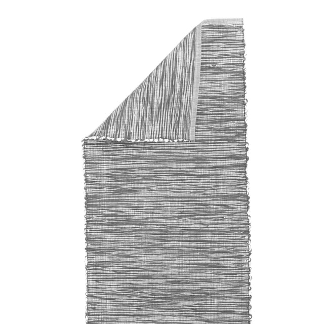 Fabstyles Shadows Cotton Table Runner 13x72 inches with a woven striped texture and folded corner showing the reverse side, made of heavyweight 100% cotton fabric, suitable for dining, kitchen, coffee, and patio tables, and ideal for indoor and outdoor use.