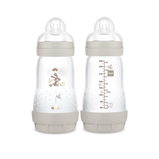 MAM Easy Start Anti-Colic Matte Bottle 9 oz 2-count set showing front and back views, clear bottles with beige matte silicone nipples and bases, decorated with woodland animal and nature motifs including a rabbit and hedgehog, with measurement markings in milliliters and UK fluid ounces, designed to reduce colic with vented base for newborn feeding.