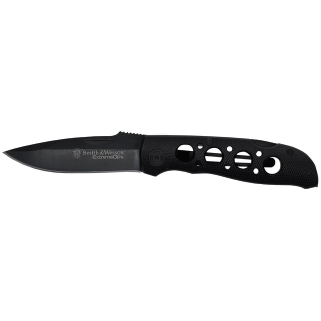 Smith & Wesson® Extreme Ops Drop Point Folding Knife with a 3.4-inch black high carbon stainless steel blade featuring nail pull and jimping, and a black textured aluminum handle with circular cutouts, liner lock, and pocket clip for secure carry.