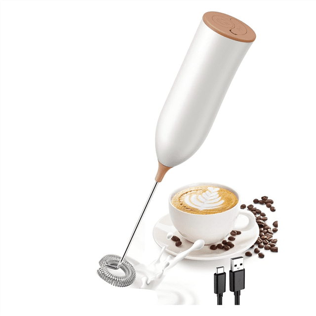 Milk Frother Rechargeable, a white handheld electric frother with ergonomic ABS casing and detachable stainless steel whisk. Features USB-C charging and a high-speed motor for frothing milk in 15 seconds. Ideal for coffee, latte, and cappuccino preparation. Shown next to a cappuccino cup and USB cable.