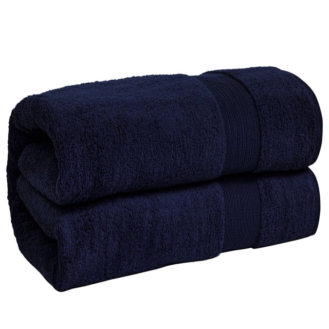 Fabstyles Oversized Premium Bath Sheet in navy blue, folded to show thick, absorbent 100% cotton fabric with a ribbed band, measuring 40 by 80 inches, suitable for drying after showers and featuring a hanging loop for easy storage.