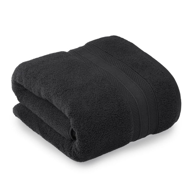 hometrends Solid 100% Cotton Bath Sheet in black, folded to show its soft, highly absorbent 550 GSM cotton fabric with a textured woven band, designed for a spa-like bathroom experience and often used as a beach or pool towel.
