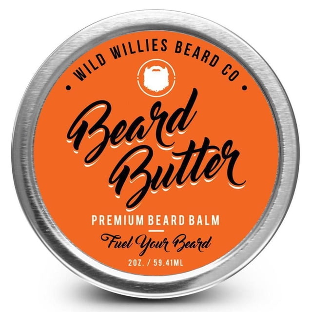 Wild Willies Beard Butter premium beard balm in a round metal tin with an orange label and black script text, containing 2 ounces (59.41 mL) of beard care balm that moisturizes and softens facial hair while conditioning skin underneath, ideal for men's grooming routines.