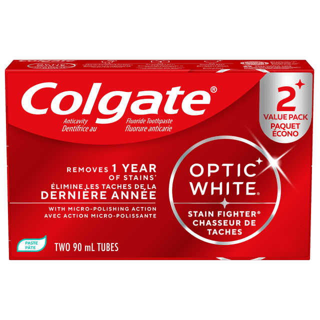 Colgate Optic White Stain Fighter Clean Mint Paste Teeth Whitening Toothpaste 2 pack with two 90 mL tubes in red packaging, featuring fluoride anticavity formula and micro-polishing action that removes 1 year of stains while freshening breath with clean mint flavour, enamel safe for daily use.