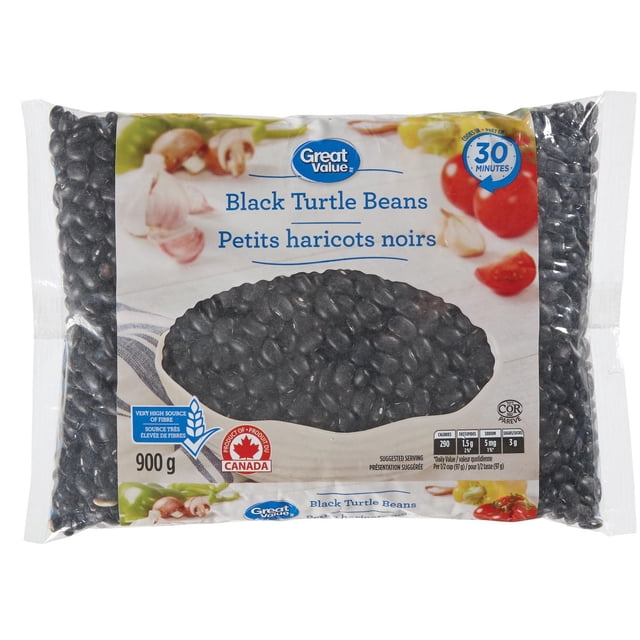 Great Value Black Turtle Beans in a 900 g clear plastic bag with a label showing black beans, garlic, and tomatoes, described as a very high source of fibre and an excellent source of iron, folate, and magnesium, cooking in 30 minutes, product of Canada with nutrition facts visible.