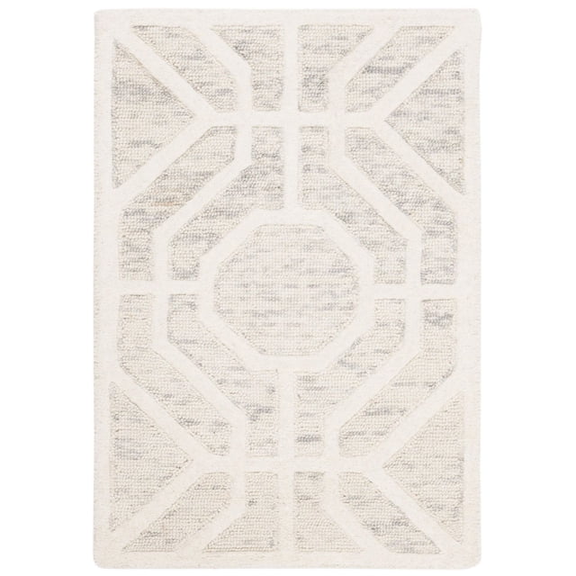 Safavieh Cambridge Johan Geometric Area Rug featuring a hand-tufted wool design with a central octagonal geometric pattern and angular shapes in cream and light gray, combining plush cut piles with high/low loop textures, ideal for adding modern American style to home or office decor.
