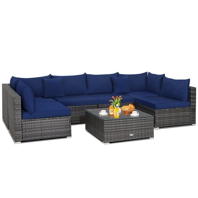 Patiojoy 7 Pcs Outdoor Patio Furniture Set with mix gray PE rattan and navy cushions. Includes 2 corner sofas, 4 single sofas, and a coffee table with tempered glass. Modular design allows various configurations for patios, gardens, or poolside. Built with weather-resistant materials and rustproof steel frame for durability. Ideal as an outdoor conversation set.