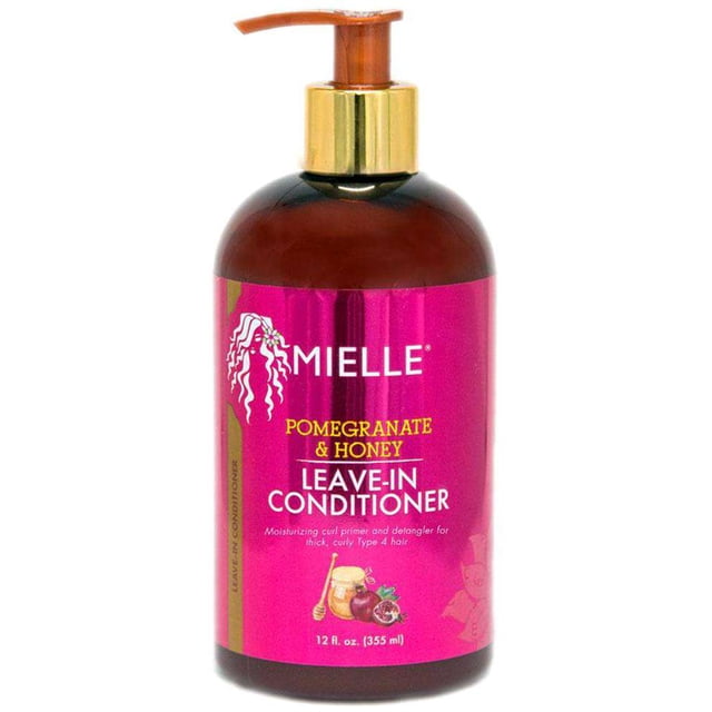 Mielle Organics Pomegranate & Honey Revitalisant Sans Rinçage en Bouteille de 12 fl oz (355 ml) avec Distributeur à Pompe. l'Étiquette Rose Vif Met en Valeur le logo Mielle Organics, le Nom du Produit et des illustrations de Grenade et de Miel, Favorisant Ses Bienfaits Hydratants et Démêlants pour Cheveux Épais et Bouclés de Type 4.