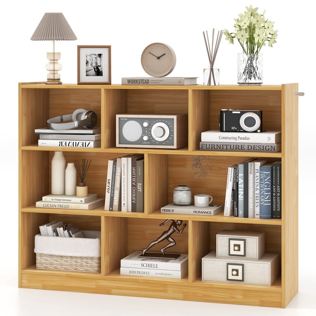 Patiojoy Wood Storage Cube Bookcase, a 3-tier bookshelf with 8 open cubbies in burlywood finish. The bookcase is displayed with books, decor, and storage boxes, emphasizing its spacious compartments and multipurpose use. Made of engineered wood and MDF, it features anti-toppling devices for safety and stability. Ideal for kids' furniture, living rooms, or offices.