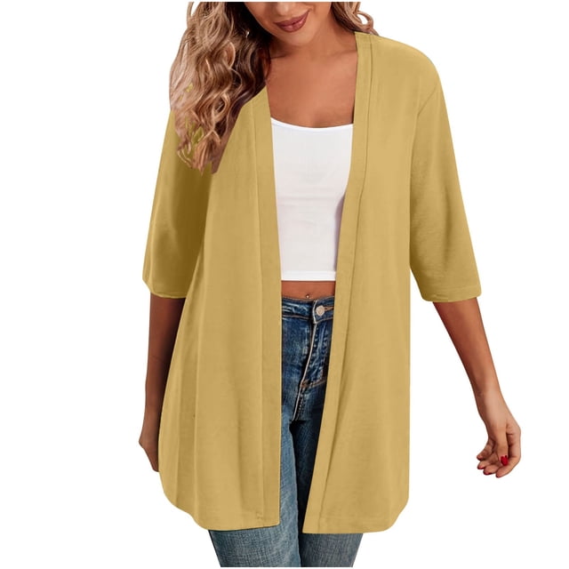 Timegard Cardigans for Women, a 1/2 sleeve open front lightweight jacket in a solid mustard yellow color. Made from soft, stretchy fabric, this casual loose-fit cardigan is styled with a white tank top and blue jeans, ideal for layering in spring, fall, or cooler weather.