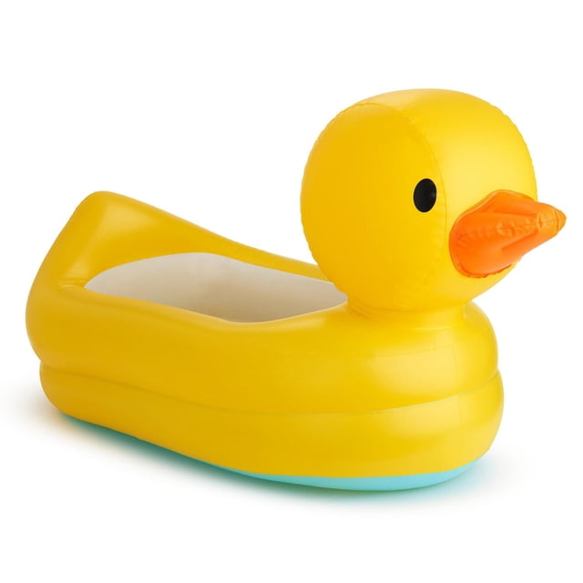 Munchkin White Hot Inflatable Duck Safety Baby Bath Tub in yellow with an orange beak, featuring White Hot technology safety disc, contoured headrest, textured non-slip surface, and recessed drain hole for easy draining, shown in a 3/4 profile view on white background.