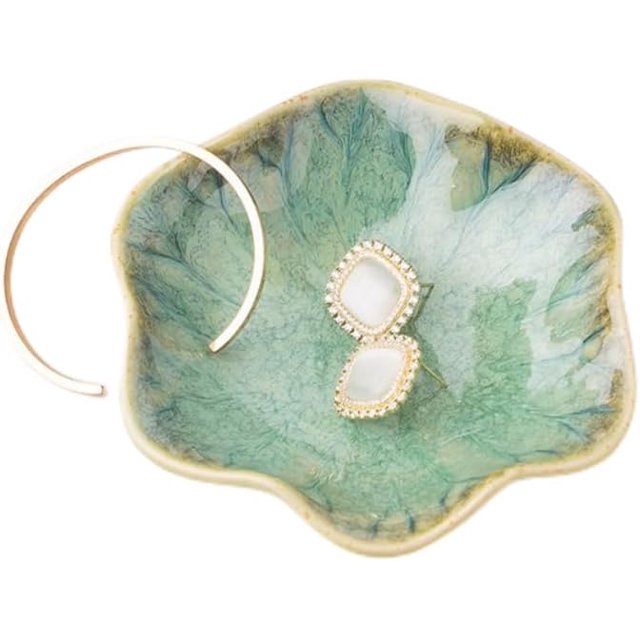 SURJDE Lotus Jewelry Tray made of glazed ceramic in a lotus leaf shape with a smooth, colorful finish. Measuring 4.3×3.7×1 inches, this trinket dish is ideal for organizing rings, earrings, keys, and small items. Shown with jewelry for display purposes, not included.