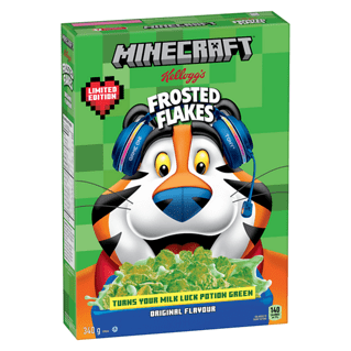 Kellogg's® Frosted Flakes Minecraft Limited Edition Cereal 340g box showing Tony the Tiger with blue headphones on a green pixelated Minecraft background, featuring green-coated flakes that turn milk green, connecting to the Minecraft gaming experience and ideal for family breakfast.