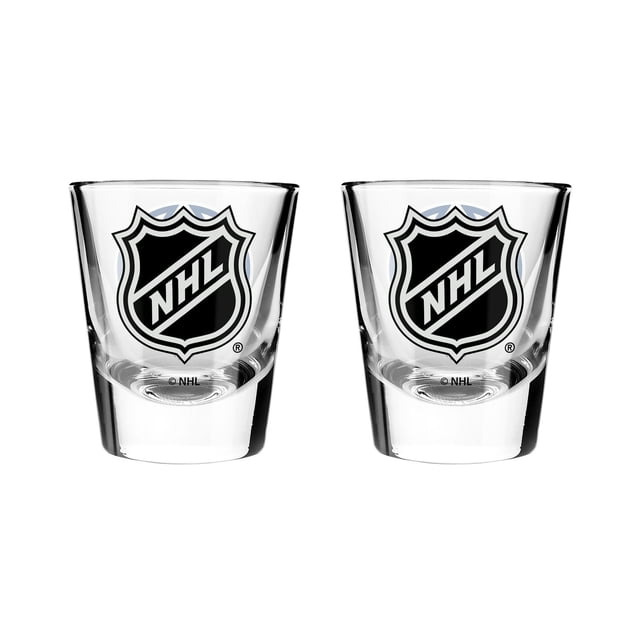 OFFICIALLY LICENSED NHL 2OZ SHOT GLASS SET with two clear shot glasses featuring a solid base and the black and white NHL shield logo, designed for home bar entertaining and dishwasher safe, also suitable for collectible display.