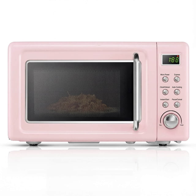 Costway 0.7 Cu.ft Retro Countertop Microwave Oven in pink with 700W power, LED display, and glass turntable. This compact retro microwave features 5 adjustable power levels, 8 automatic cooking modes, child lock, and is ideal for small spaces like apartments, dorms, and studios.