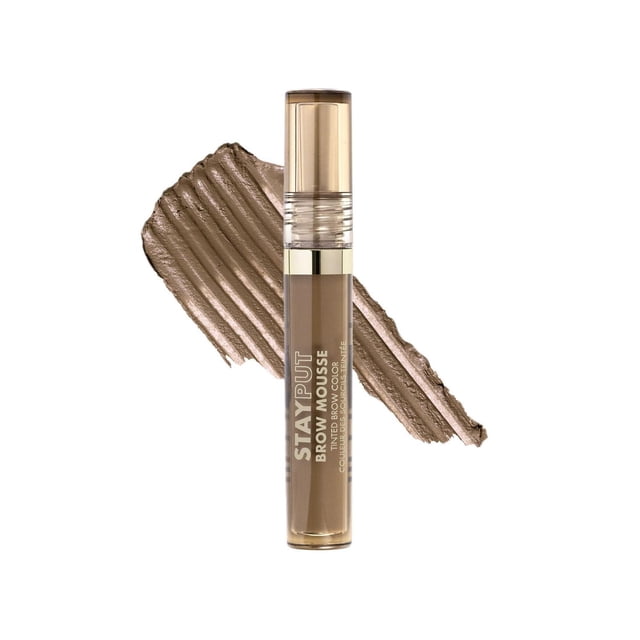 Milani Stay Put Brow Mousse Tinted Brow Color in a clear tube with gold cap, shown with a textured taupe mousse swatch behind, a smudge-proof, nourishing eyebrow tint mousse that thickens and holds brows for up to 16 hours.