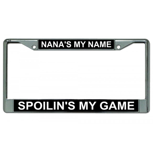 Nana's My Name Spoilin's My Game chrome license plate frame designed for 6" x 12" license plates. Features durable chrome plating, multicolour full-color inserts, and pre-drilled holes for easy mounting. Ideal as a decorative license plate accessory for vehicles.