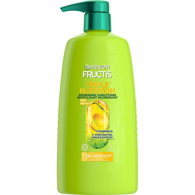 Garnier Fructis Triple Nutrition Conditioner 1 L bottle with green pump dispenser, lime green container featuring nourishing formula with vitamin E, avocado, olive, and almond oils to restore strength, smoothness, and shine for dry to very dry hair.