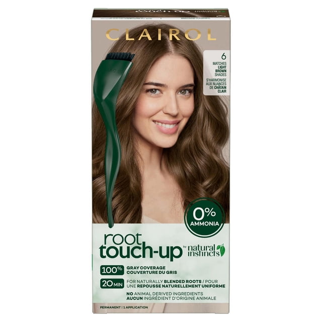 Clairol Root Touch-Up by Natural Instincts permanent hair dye box in light brown shade with a green applicator brush, featuring 0% ammonia, 100% gray coverage in 20 minutes, cruelty-free ingredients, and natural root blending for at-home use.