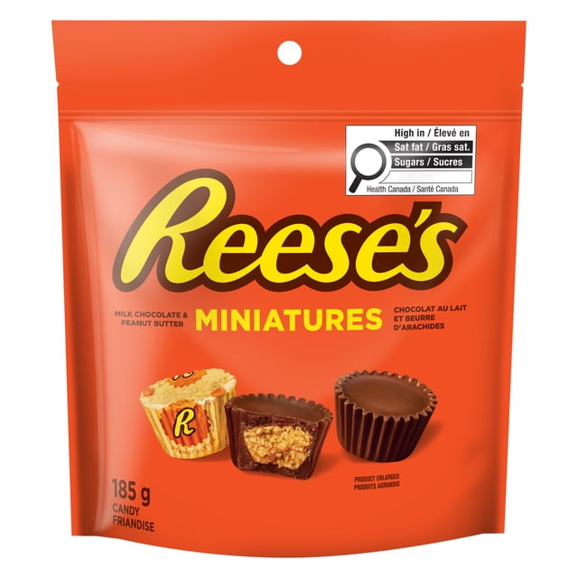 REESE'S Miniatures 185G resealable orange bag containing milk chocolate and peanut butter candies, showing three miniature chocolates including one cut open to reveal peanut butter filling, with Health Canada label for high saturated fat and sugar content.