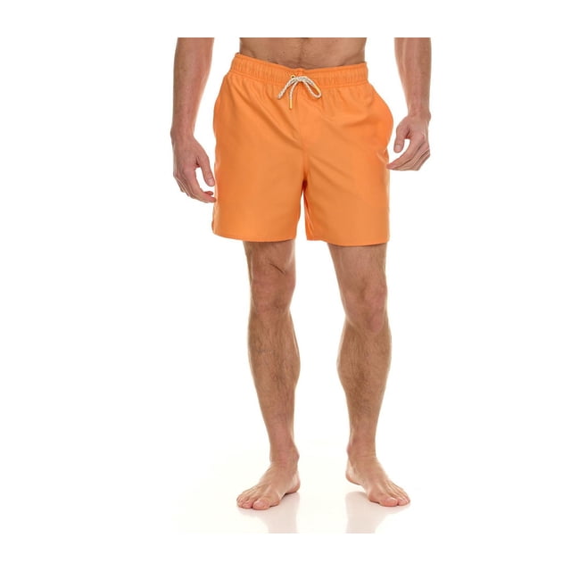 Laguna Men's New Islander 6" Volley Swim Trunk in bright orange with elastic waistband and white braided drawstring, 6-inch inseam, side and back flap pockets with velcro closure, made with UPF50+ fabric for sun protection, worn by a male model standing barefoot on a white background, also suitable for casual beachwear.