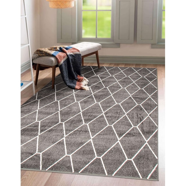 ECARPET Contemporary Area Rug for Living Room, Bedroom, Dinning Hall, Diamante Collection in grey with minimalist geometric white lines on plush material, placed on light wood flooring under a beige cushioned bench with wooden legs and a multicolored throw, in a bright room with large windows and grey trim, family and pet friendly.