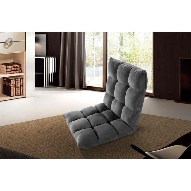 Velago Clam Adjustable Folding Plush Floor Gaming Chair in dark grey plush microfiber with tufted foam padding and adjustable backrest, shown on a brown woven rug in a bright living room with large windows and neutral curtains, ideal for gaming, reading, or extra seating.