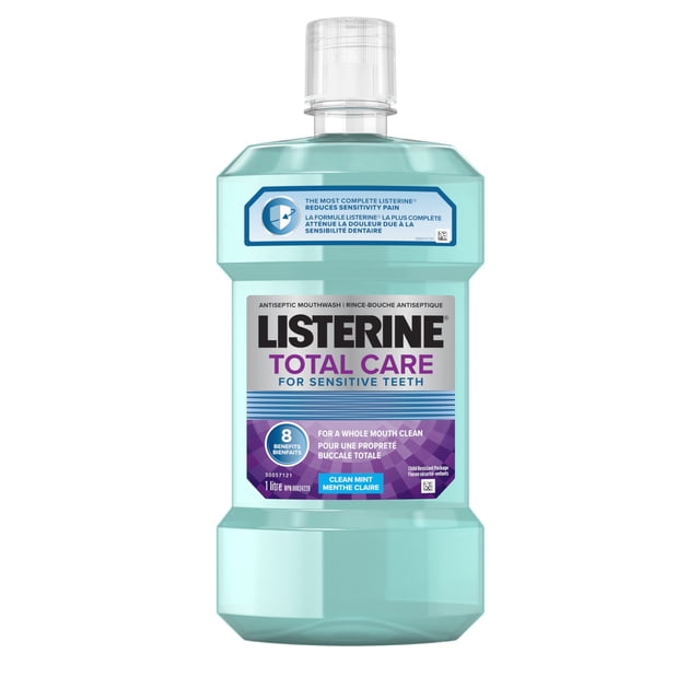 Listerine Total Care Mouthwash for Sensitive Teeth in a 1-litre translucent light blue plastic bottle with a clear child-resistant cap, labelled with 8 benefits including sensitivity pain relief, plaque and gingivitis prevention, enamel strengthening, and clean mint flavour for comprehensive oral care.