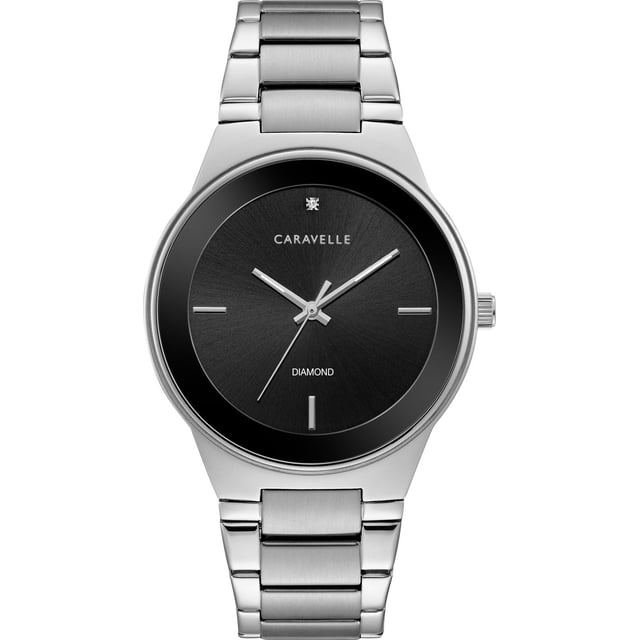 Caravelle Mens Silver-Tone Quartz Watch with 40mm stainless steel case and bracelet, matte black dial with minimalist hour markers and single diamond at 12 o'clock, double-press fold-over closure, and water resistance up to 30m, often used as a stylish accessory for formal occasions.