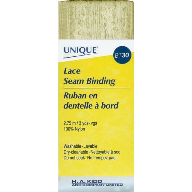 UNIQUE Lace Seam Binding, 18mm wide by 2.75m long, 100% nylon beige lace trim with semi-transparent texture and a yellow label showing washable and dry-cleanable care instructions, suitable for finishing hems and fabric edging on lightweight or stretchy textiles.
