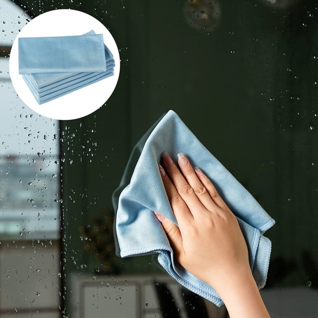 LPSSTORE Microfiber Glass Cleaning Cloths Kitchen Absorbent Wipes No Streak Glass Cloths 6 Piece Home Cleaning Set. A hand using a light blue microfiber cloth to clean a glass surface, leaving no streaks. Inset shows a stack of folded cloths, ideal for quick-drying and scratch-free cleaning.