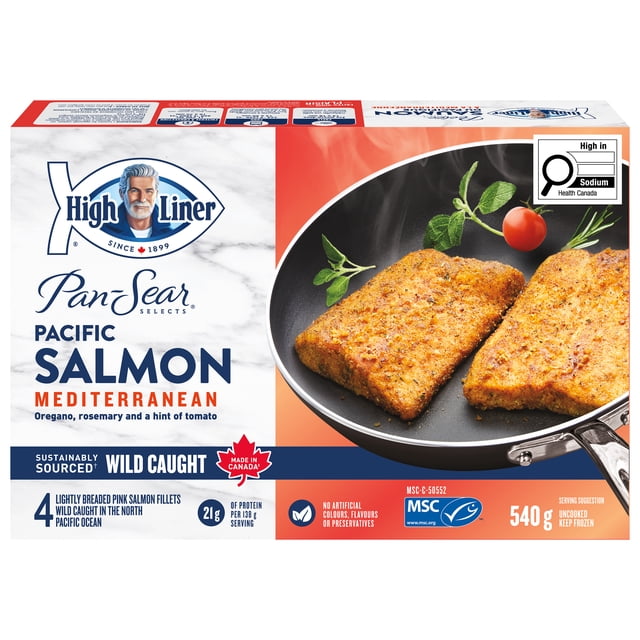 High Liner Pan-Sear Selects Mediterranean Wild Pacific Salmon showing two lightly breaded salmon fillets seasoned with oregano, rosemary, and a hint of tomato cooking in a black frying pan with fresh herbs and a cherry tomato, packaged as 540 g sustainably wild caught pink salmon fillets with no artificial colours or preservatives, suitable for pan-sauté or air frying.