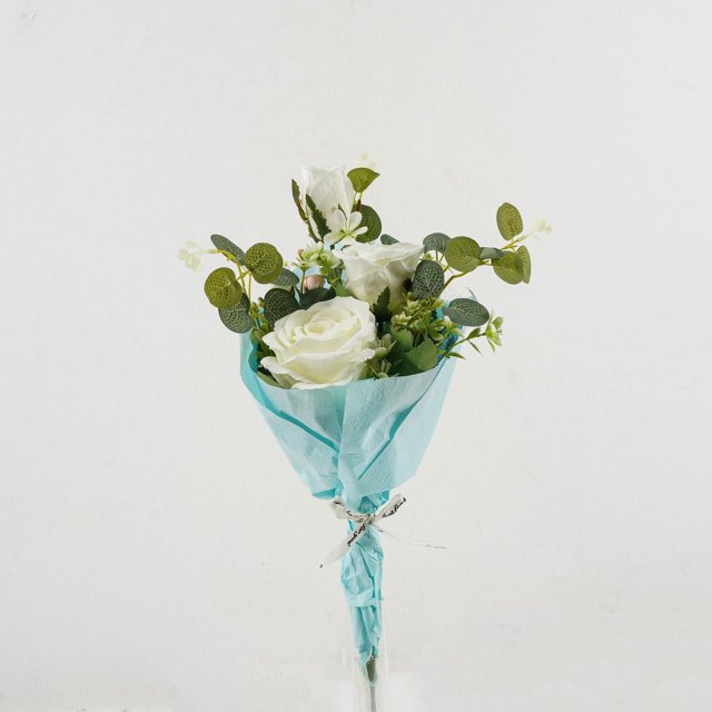 Lerman Decor White rose bouquet with three white artificial roses on bendable stems, accented by greenery and baby's breath, wrapped in light blue paper tied with a white ribbon, suitable for home décor or event centerpieces without watering.