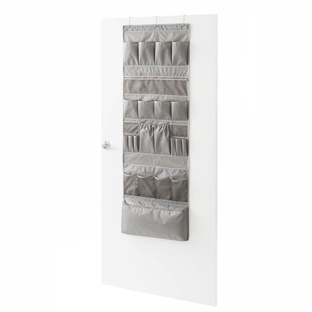 Neatfreak! 25 Pocket Over The Door Accessory Organizer in grey wipe-clean fabric hanging on a white door, featuring 25 pockets of varying sizes for storing socks, scarves, toiletries, and small items, ideal for bedrooms, closets, or bathrooms, and often used for organizing craft supplies or small tools.