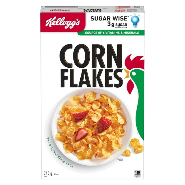 Kellogg's Corn Flakes Cereal, 340 g box with a front view of a white bowl filled with crunchy golden corn flakes topped with sliced strawberries, featuring sugar wise 3g sugar per serving and source of 6 essential vitamins and minerals, suitable for a nutritious breakfast.