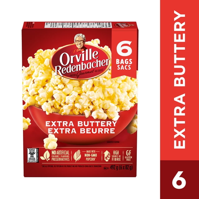 Orville Redenbacher Popcorn - Microwave Extra Buttery - 6 Bags box displaying a red bowl filled with extra buttery popcorn, made with gluten free, non-GMO whole grain kernels, no artificial colours, flavours, or preservatives, and a high source of fibre, total 492 grams (6 x 82 g).