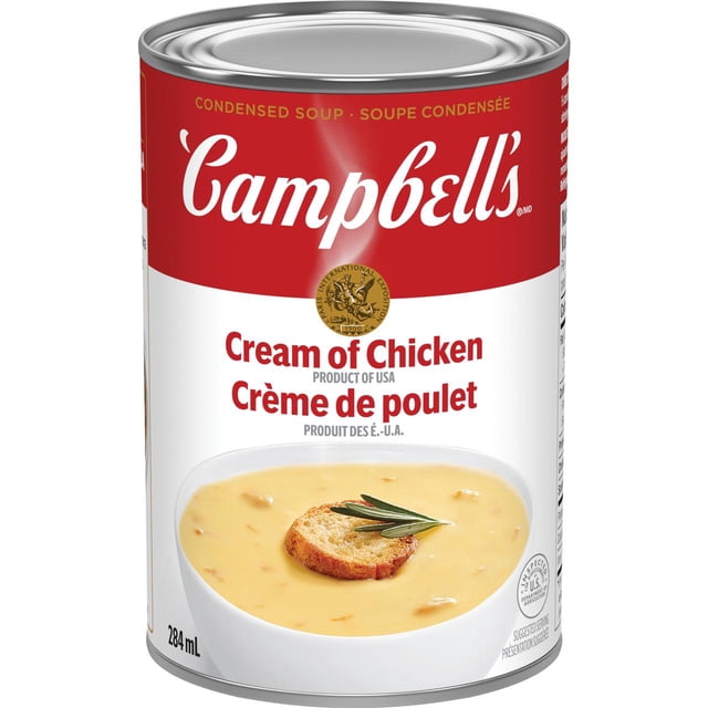 Campbell's® Soupe Condensée à la Crème de Poulet, Conserve à Température Ambiante, Boîte de 284 ml avec Étiquette Rouge et Blanche Mettant en Vedette le logo Campbell's, Texte Bilingue Anglais et Français, et une image de Soupe de Poulet Crémeuse Garnie d'Un Brin de crouton Grillé et de Romarin, Souvent Utilisée comme Ingrédient Polyvalent pour la Cuisine.