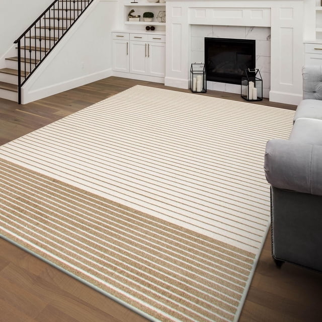 ECARPET Modern Area Rug for Living Room, Dining Room and Bedroom Madison Collection with minimalist tan and white stripes and plush texture, placed on hardwood flooring in a modern living room featuring white built-in cabinetry, a fireplace, and a gray sofa, also ideal as an accent rug for family homes.