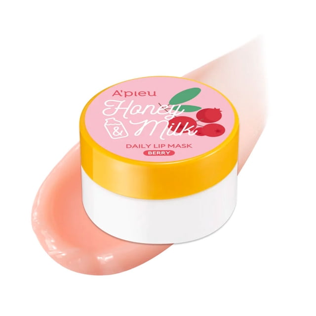 APIEU Honey & Milk Daily Lip Mask 6g - Berry in a white jar with a yellow lid and pink label featuring berry graphics, placed on a smooth smear of pink lip mask cream, formulated to deeply hydrate and soothe dry, chapped lips.