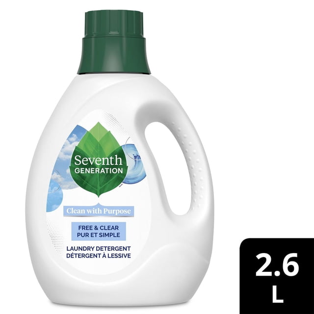 Seventh Generation Free & Clear Liquid Laundry Detergent in a white plastic bottle with a green cap, featuring a green leaf logo and label stating it is free of dyes, fragrances, and artificial brighteners, designed for sensitive skin and effective in HE and standard machines, with a 2.6 L volume, also suitable for naturally removing tough stains.