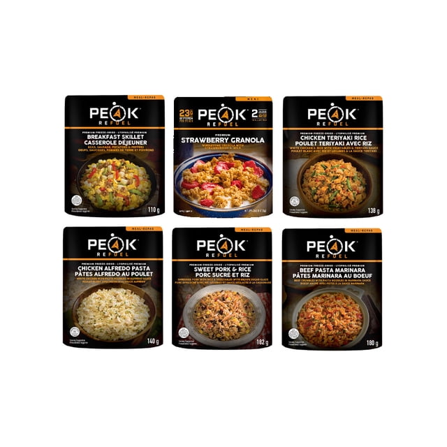 Peak Refuel Freeze Dried Meals Variety 6 Pack featuring six meal pouches: Chicken Alfredo Pasta, Sweet Pork & Rice, Beef Pasta Marinara, Chicken Teriyaki Rice, Breakfast Skillet, and Strawberry Granola. Each pouch contains 100% real meat and premium ingredients, offering ultra-high protein and freeze-dried convenience. Designed for camping, hiking, hunting, or biking, these meals are ready in minutes by just adding water and can be prepared directly in the pouch.