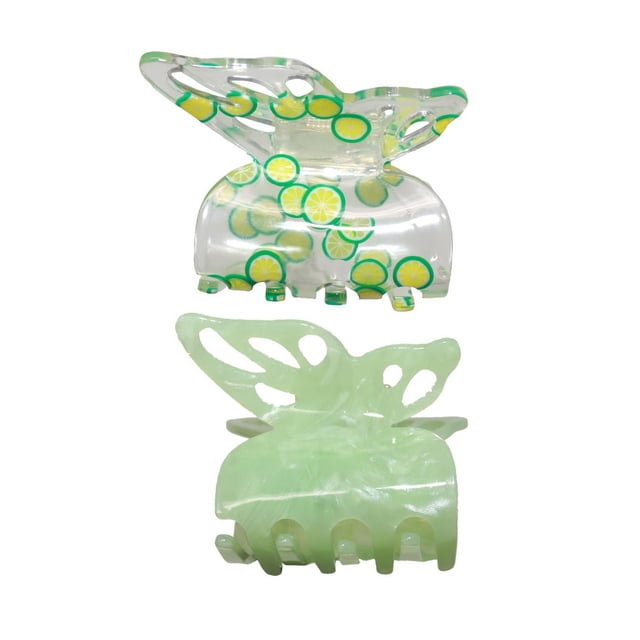 Justice Hair Accessories 2 pack butterfly hair claw clips for kids, featuring one clear clip with yellow and green lemon slice patterns and one solid light green clip, both with butterfly-shaped tops and curved gripping teeth, ideal for securing and styling hair.