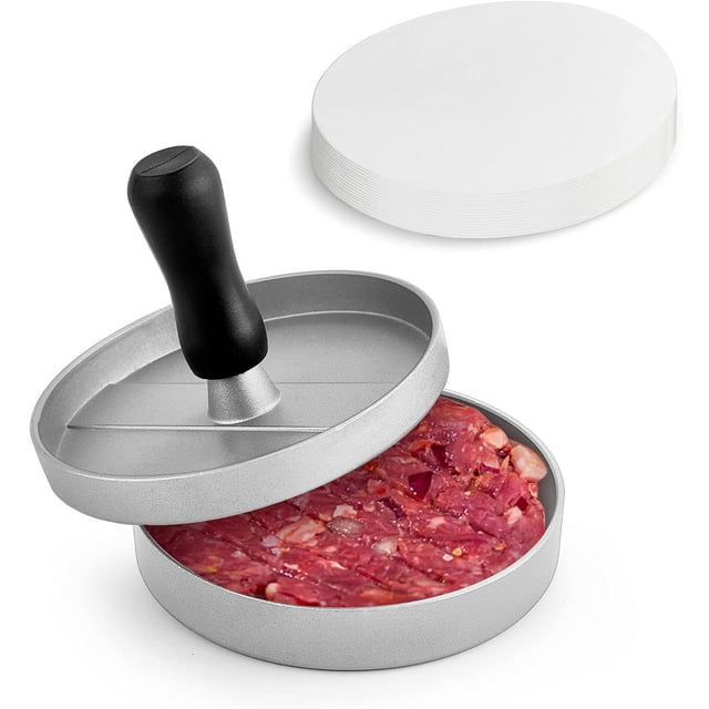 Hamburger Press Patty Maker Aluminum Non-stick Burger Patty Press Mold with a round aluminum base and black handle. The press is shown with a raw meat patty inside, featuring grooves for a patterned finish. Includes a stack of white wax paper discs for easy patty separation. Ideal for making uniform patties for burgers, crab cakes, or veggie burgers. Suitable for indoor and outdoor grilling.