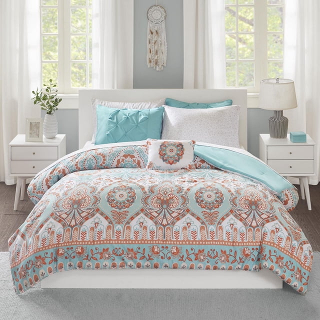 Home Essence Apartment Skylar Bed in a bag featuring a twin comforter set with vibrant aqua and orange globally inspired pattern, solid aqua reverse, pintucked aqua sham, decorative pillow, and complete microfiber sheet set on a white platform bed in a bright bedroom with white curtains and matching nightstands.