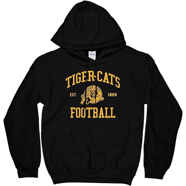CFL Hamilton Tiger Cats Tiger-Cats Tiger Cats Chandail à Capuchon de Football Noir Très Grand Mettant en Vedette un Graphique Jaune Audacieux « Tiger-Cats Football » avec le logo de l'Équipe et le Texte « EST. 1869 » à l'Avant. Fabriqué en Coton de Haute Qualité, Ce Chandail à Capuchon Noir Offre Confort et Durabilité. Conçu pour les Adultes Non Genrés, Il Comprend une Poche Kangourou avant et un Capuchon à Cordon de Serrage Ajustable, Ce Qui le Rend Idéal pour les fans des Hamilton.