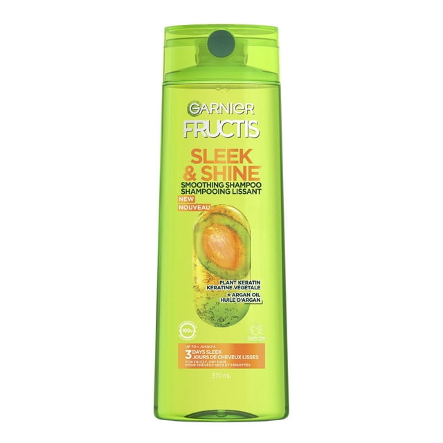 Garnier Fructis Sleek & Shine Fortifying Shampoo in a translucent green 370 mL bottle with flip-top lid, enriched with plant keratin and Moroccan argan oil to smooth and control frizz for up to 3 days, ideal for dry, frizzy hair care.