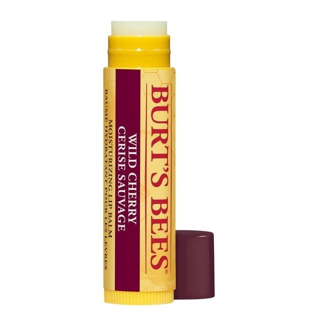 Burt's Bees 100% Natural Moisturizing Lip Balm in Wild Cherry, a yellow cylindrical tube with maroon cap removed, labeled with brand and product name, formulated with natural ingredients to hydrate and soothe lips, ideal for daily lip care.