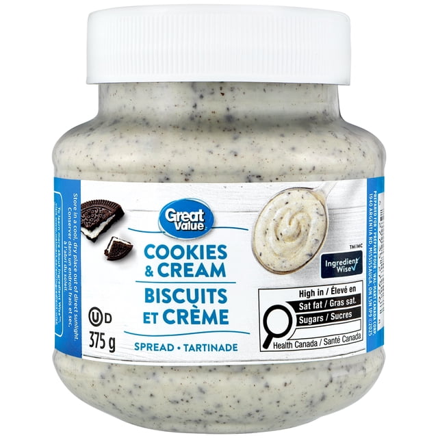 Great Value Cookies & Cream Spread 375 g jar with white lid, showing creamy white spread with cookie pieces in a clear plastic container, labeled in English and French with Ingredient Wise certification and Health Canada nutritional info, suitable for toast, pancakes, and as a dessert topping.