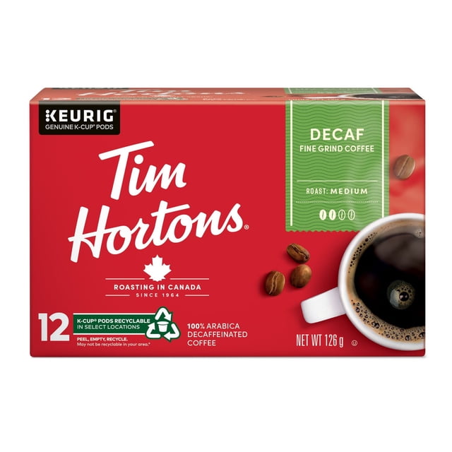 Tim Hortons Medium Roast Decaffeinated Coffee 12-count Keurig K-Cup pods box in red with white and green accents, featuring a cup of brewed black coffee and coffee beans, made from 100% Arabica beans and recyclable pods suitable for single-serve brewers.